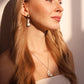 beautiful girl with pearl droplet sparkling earrings 